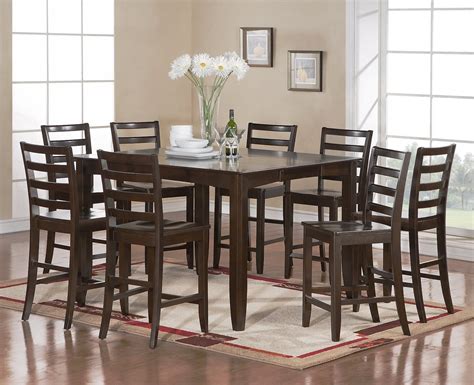 It includes an extendable pub table and four ladder back bar stools, so the whole family can gather around for dinner. Fairwinds 7-PC Square Counter Height Dining Table Set in ...