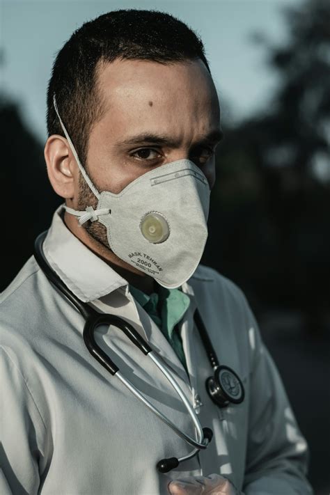 Doctor Wearing A Mask Photo Free Doctor Image On Unsplash