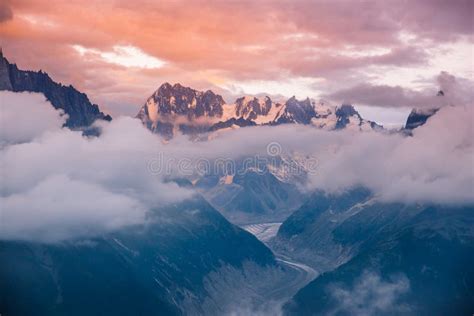 Cloudy Sunset Over Iconic Mont Blanc Mountains Range And Glaciers Stock