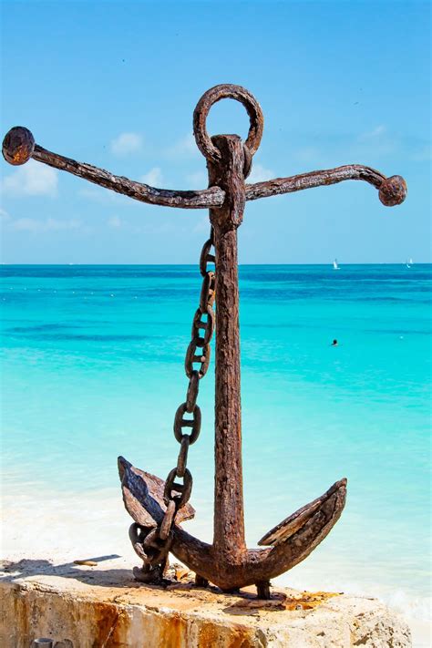 An anchor is a device, normally made of metal, used to connect a vessel to the bed of a body of water to prevent the craft from drifting due to wind or current. 500+ Anchor Pictures | Download Free Images on Unsplash