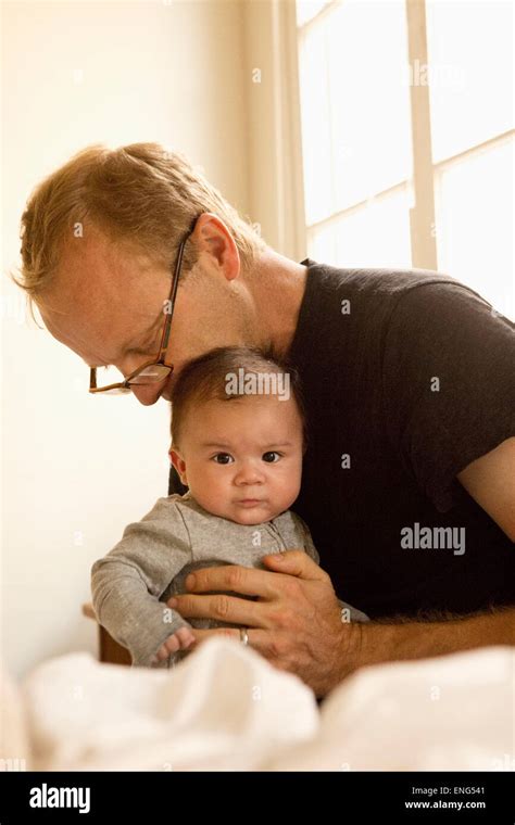 Father Kissing Baby On Head Hi Res Stock Photography And Images Alamy