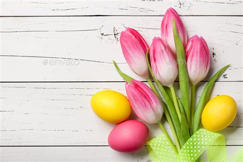 Fresh Pink Tulips And Easter Eggs On Wooden Background Stock Photo By