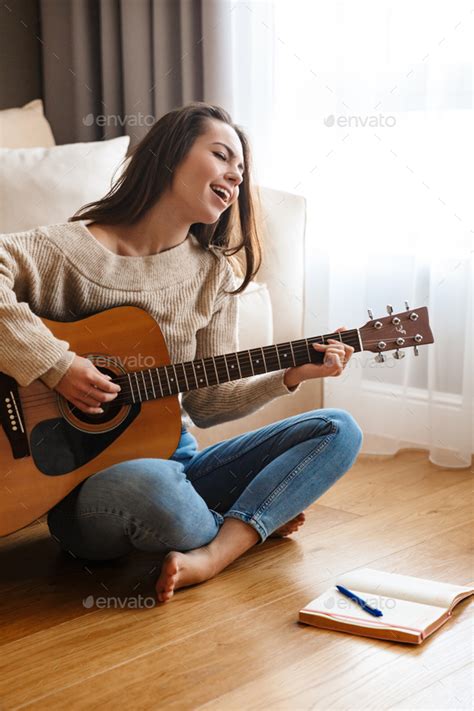 Image Of Nice Beautiful Woman Playing Guitar And Singing Song Stock