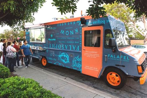 From bright colors to cute symbols and bold typography, there are plenty of ways to stand out on the road and draw a crowd. Falasophy food truck branding - Grits + Grids