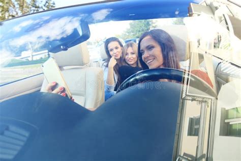 Group Of Girls Having Fun In The Car And Taking Selfies With Camera Stock Image Image Of Race
