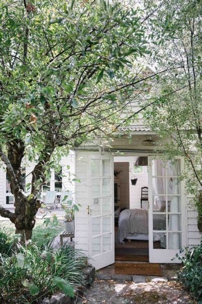 Cozy White Cottage With Trees French Doors Interior Design
