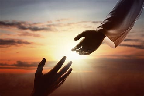 Jesus Christ Giving A Helping Hand To Human Stock Photo Download