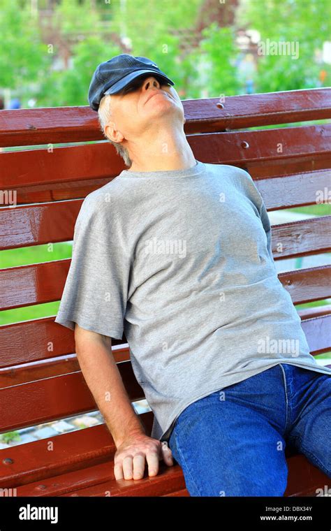 Man Sleeping On A Bench Stock Photo Alamy