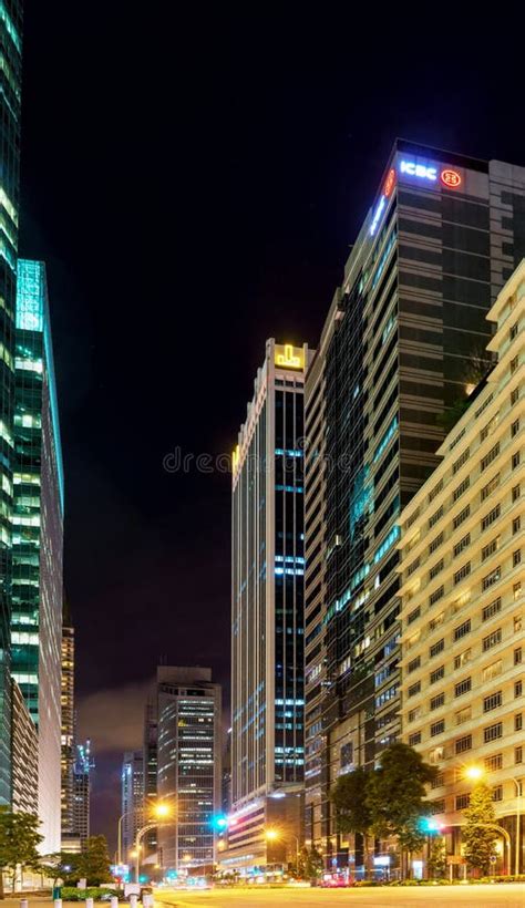 Skyscrapers And Road In Center Of In Singapore At Night Editorial
