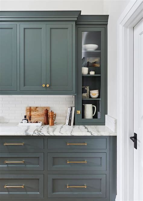 We love the countertop that can also serve as a dining table. We Want These Green Kitchen Cabinets Stat | Green kitchen ...