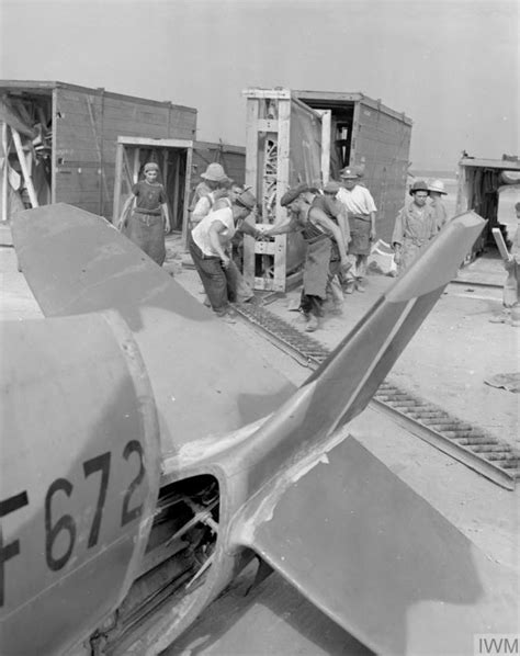 Civilian Workers Running The Wing Of A Supermarine Spitfire Mark Viii