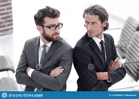 Two Men Standing Back To Back And Support Each Other Stock Photo Image Of Good Hand