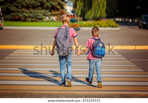 Two Boys Backpack Walking Holding On Stock Photo Edit Now 475229137