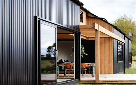Stained Cedar Cladding Vertical With Metal Cladding Black House
