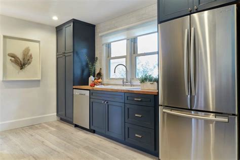 Navy and white kitchen cabinet painting painting kitchen. Kitchen Trend: Navy Blue Cabinets - Scott McGillivray ...