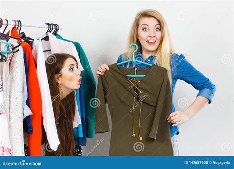 Women Clothes Shopping Choosing Dress Stock Image Image Of Indoors