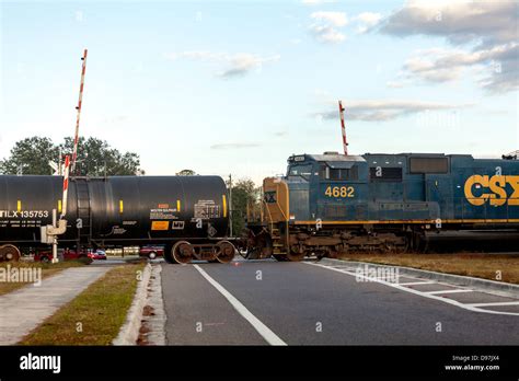 Csx Engine 4682 Pulling A Freight Train Including A Black Tank Car