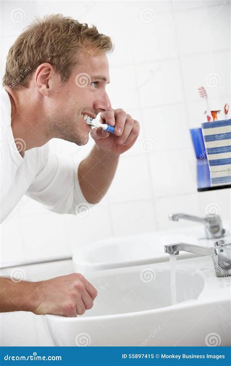 Man In Bathroom Brushing Teeth Stock Image Image Of Looking Hygiene 55897415