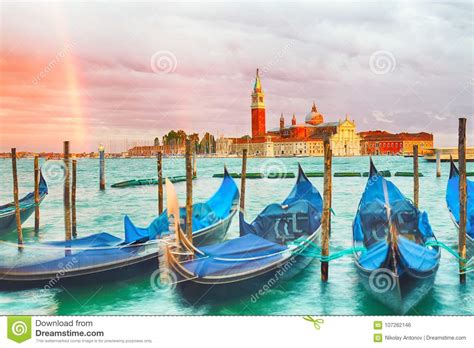 Colorful Landscape With Sunset Sky Rainbow And Gondolas Parked Near Piazza San Marco In Venice