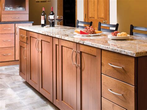 Swap them for a dark or black hardware to compliment your backsplash. Wood Kitchen Cabinets: Pictures, Options, Tips & Ideas | HGTV
