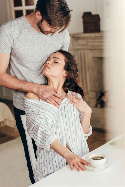 Man Touching Chest Of Young Passionate Woman At Home Stock Image