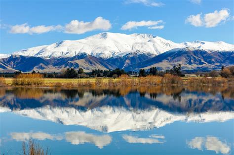 Reflection Of Snowy Mountains Near Fairlie New Zealand Stock Image