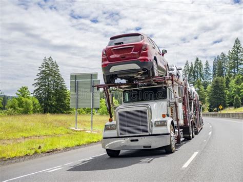 Capacious Car Hauler Big Rig Semi Truck Transporting Cargo On Modular