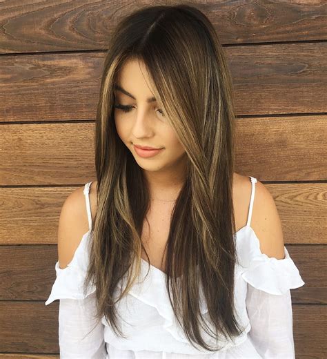 Long Messy Straight Textured Hair With Center Part And Brunette Reverse Balayage Color The