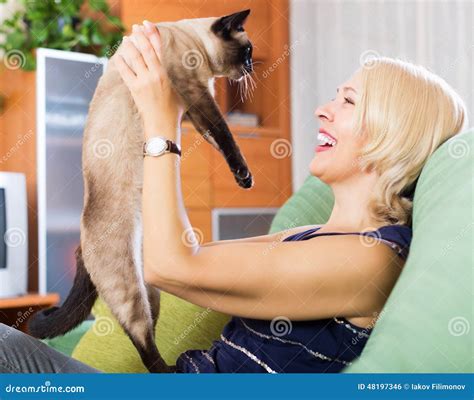 Woman Playing With Siamese Kitten Stock Photo Image Of Person