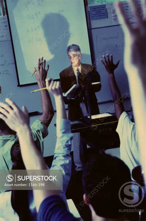 Teacher Explaining With The Help Of An Overhead Projector Superstock