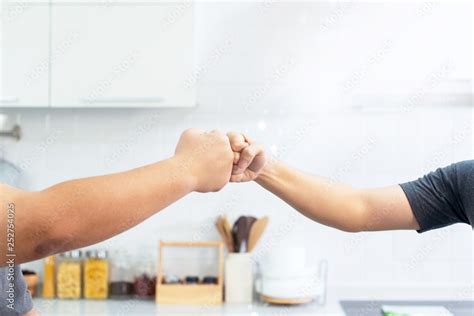 Fat Man And Trainer Bumping Fists On Kitchen Room Trainer And Fat Man Giving Fist Bumping Stock
