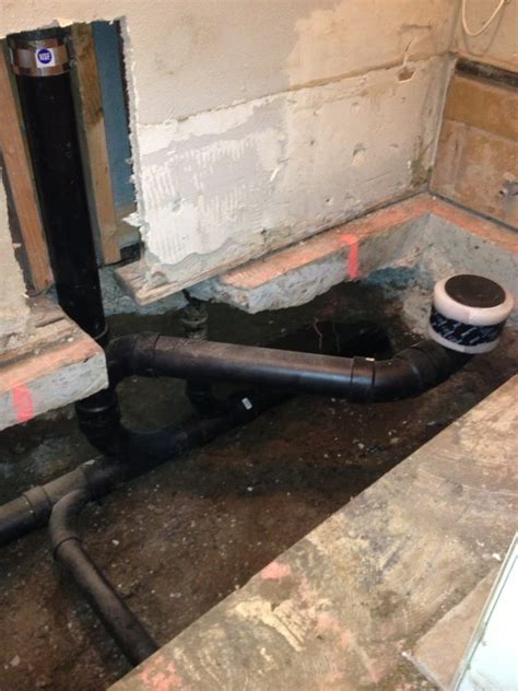 The toilet should have a 3 drain coming from the toilet and has to leave the room some where. Mainline, Toilet drain, Vent stack and sink drain ...