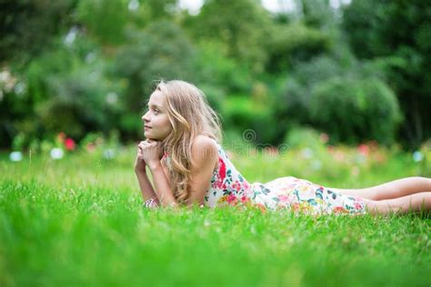 Beautiful Young Girl Lying On The Grass Stock Image Image Of Green