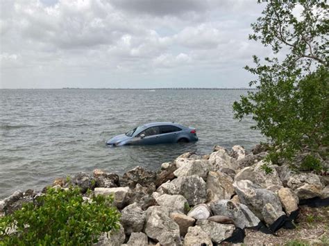 Car Parked In No Parking Area Along Florida Causeway Submerged After