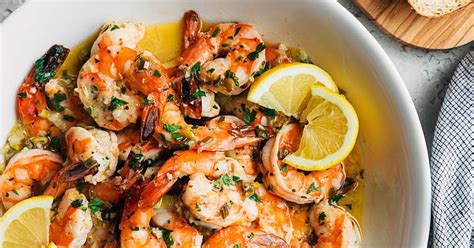 Some call for tomatoes and lemon, others for parsley and tarragon. Easy Shrimp Scampi with White Wine and Lemon | Striped Spatula