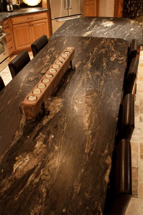Your kitchen counter slabs surface can be honed, polished, or leathered. Leathered Titanium granite kitchen island | Leather ...