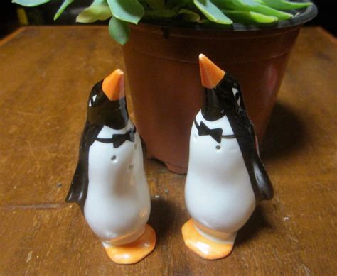 Salt and pepper shakers or salt and pepper pots, of which the first item is normally called a salt cellar in british english, are condiment dispensers used in western culture that are designed to allow diners to distribute grains of edible salt and ground peppercorns. Vintage Ceramic Penguin Salt and Pepper Shakers | Vintage ...
