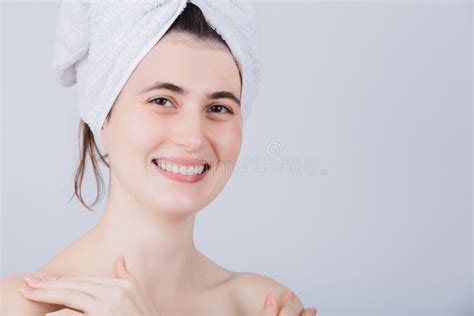 Young Woman With Towel On Head Smiling To Camera Body Care Concept