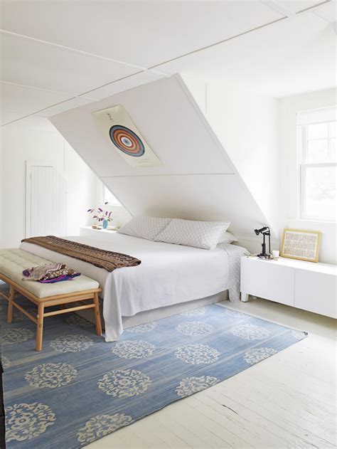 Sloped ceilings with white beams and a darker background color provide a classic and transitional feel for a bedroom. Small attic Bedroom Sloping Ceilings Low Ceiling Bedroom ...