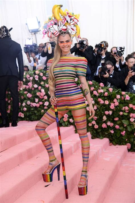 Cara Wore A Rainbow Romper With Puffed Out Sleeves The Romper Was See