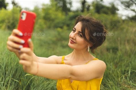 The Girl Takes A Selfie Summer Selfie The Girl Spends Time In The Park And Takes Selfies