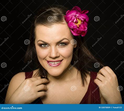Portrait Of Beauty Brunette Woman With Flower In Her Hair Stock Image