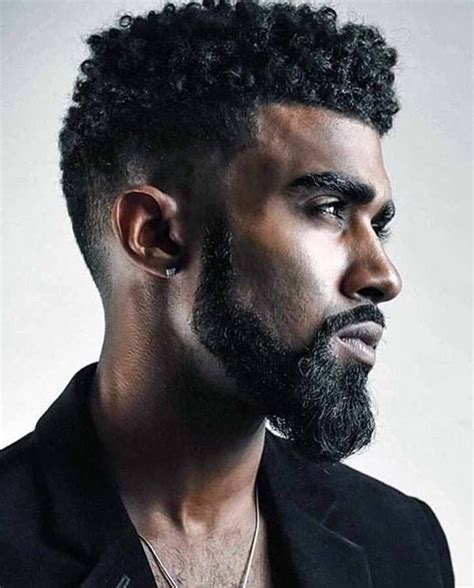This cool medium length haircut for black hair wears that classic high top with curly texture. Men's Hairstyles 2020 : Black Men with Curly Hair