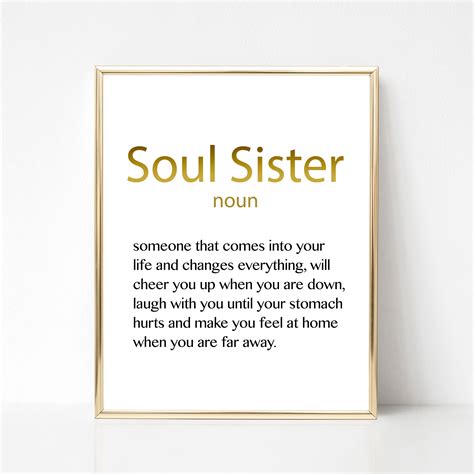 A Framed Poster With The Words Soul Sister In Gold Foil On Its White