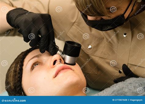Dermatologist Examines Moles With Dermatoscope Stock Photo Image Of