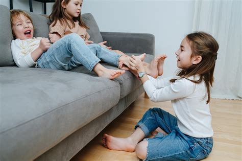 Premium Photo Side View Of A Girl Conducting Tickling Competition