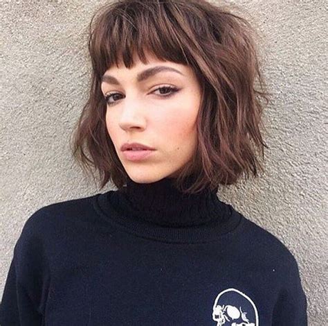 Inverted bob hairstyle with short, eyebrow grazing bangs colored in pink shade on a slight patch for a different look. 55 Best Short Layered Bob With Bangs | Hairstyles and ...