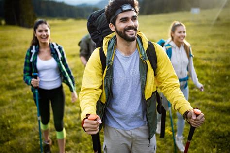 Group Of Hikers Walking On A Mountain And Smiling Stock Image Image