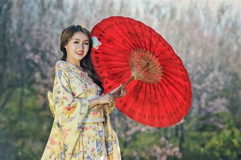 2048x1365 asian girl yellow flower model oriental sword brunette woman long hair