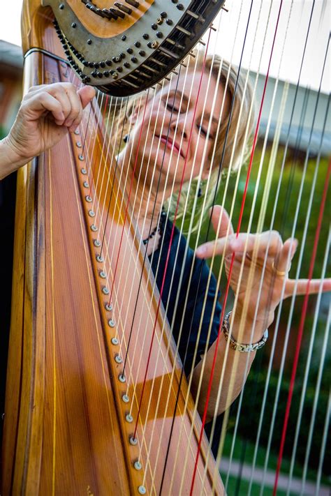Woman Playing The Harp